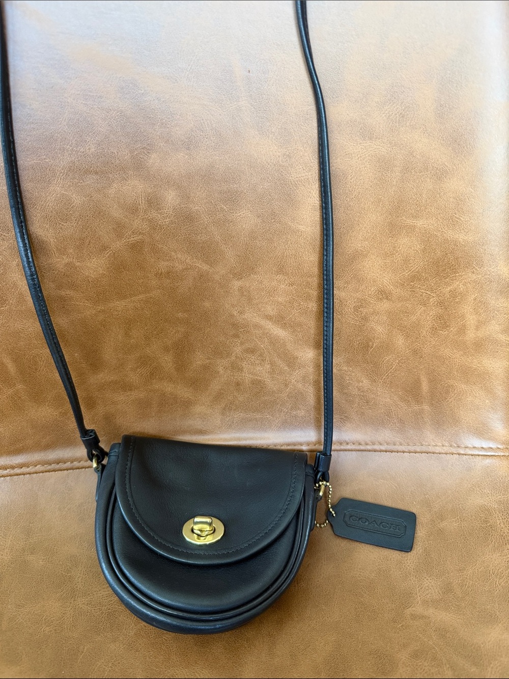 Vintage Coach Black Leather Round Crossbody with Gold Turnlock.